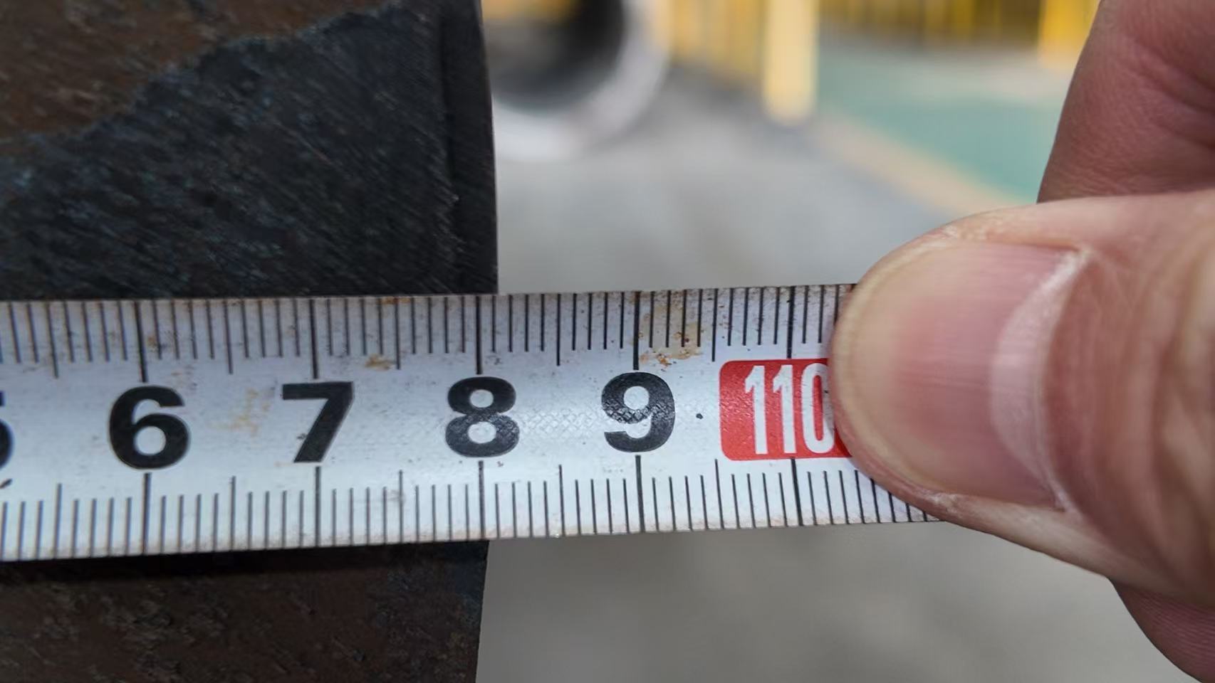 Team member measuring the thick wall of a large diameter pipe. Team member measuring the thick wall of a large diameter pipe.